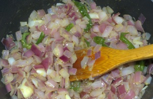 Roasting onion & green chilies